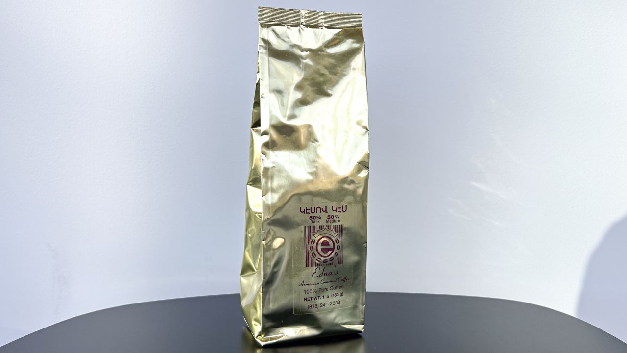 Gold bag of Edna's Armenian coffee placed against white background.