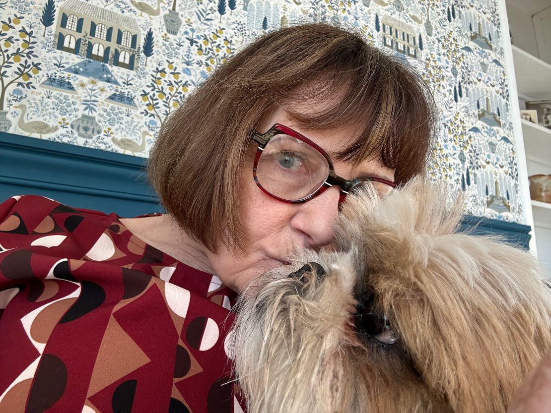 Janice in her apartment in Fontainebleau with her dog Max.