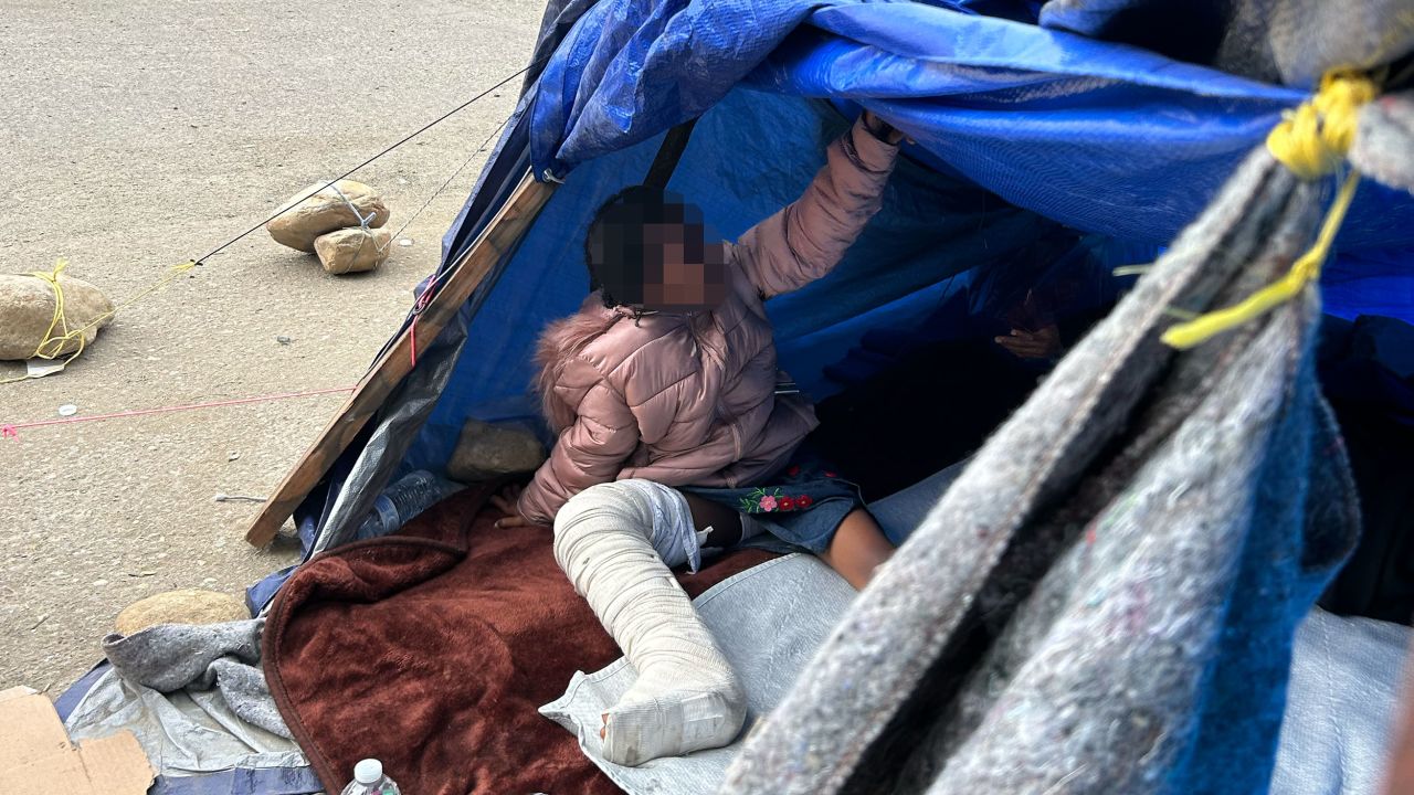 A humanitarian aid worker said Border Patrol agents dropped off an 11-year-old girl in a full leg cast at a camp known as Whiskey 8, along the California border with Mexico. A portion of this image has been obscured by CNN to protect an minor's identity.