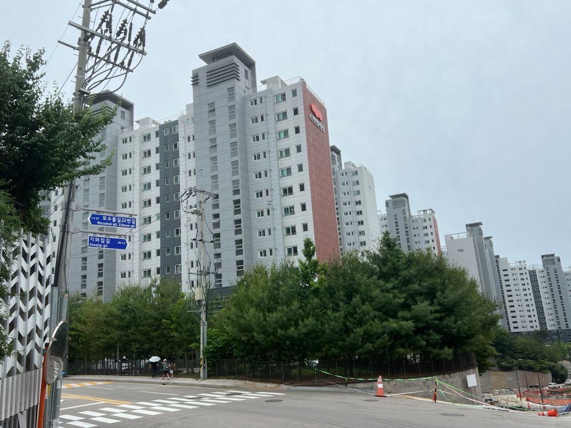 The family's main tile-roofed house in Chuncheon has been replaced with a modern apartment complex, seen here on June 13.