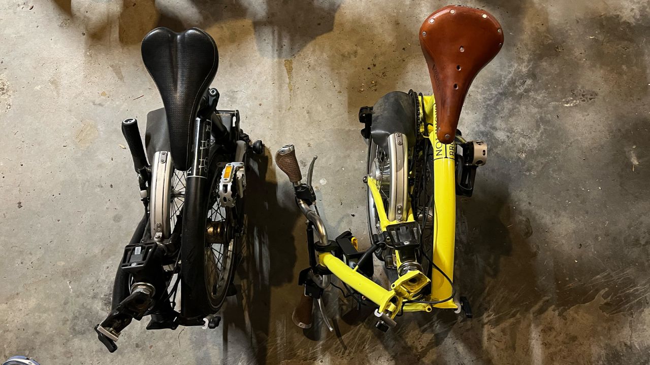The Swytch Kit is a bit clunky when installed on folding bikes; we'd like to see a better-refined mounting option. As currently configured it interferes with the compactness of the fold on this Brompton (standard Brompton fold on the black bike at left; Swytch-installed fold on the yellow bike on the right).  A block mount is available, but that interferes with luggage mounting, so there isn't yet a great solution.