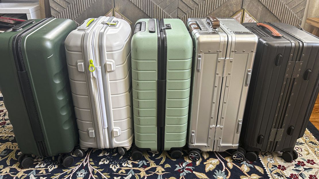 A photo of the sides of five carry-on bags