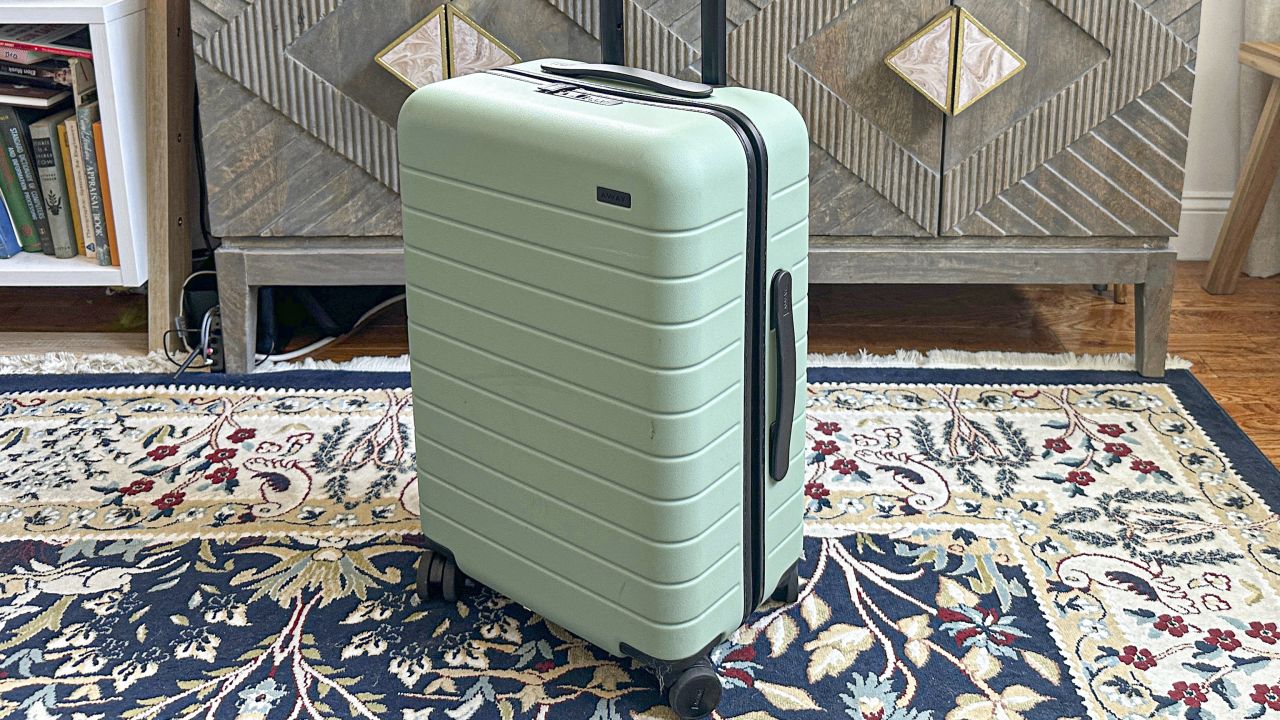 A photo of Away's The Bigger Carry On luggage on top of a carpet