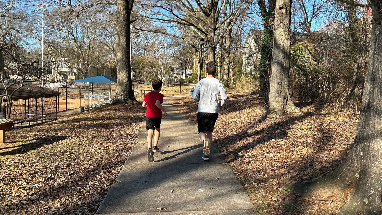 CNN Senior Writer Thomas Lake, right, runs with his son.