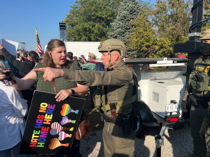 Border Patrol Chief Patrol Agent Gregory Bovino,center, was seen directing protesters and media away from a Immigration and Customs Enforcement facility in Broadview, Illinois.