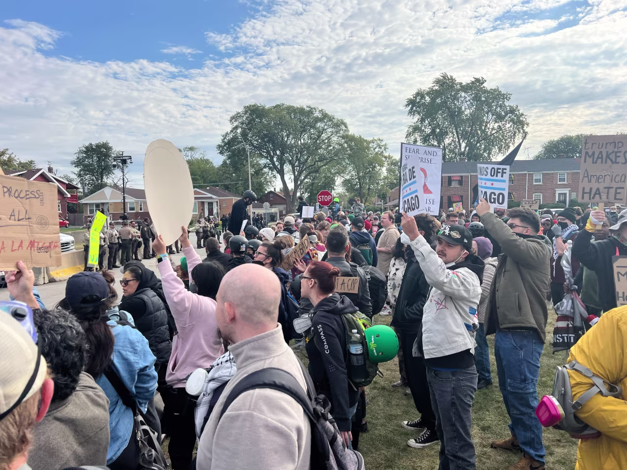 People gathered at a designated area for protests, a block away from the Immigration and Customs Enforcement facility in Broadview, Illinois.