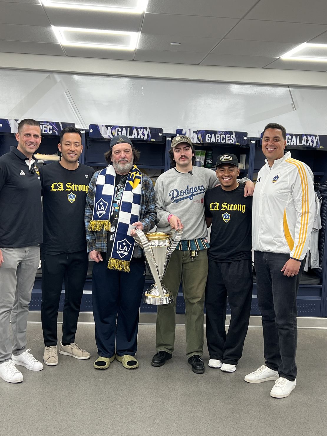 Steve (third from left) and Lucian (third from right) pose with Galaxy members of staff.