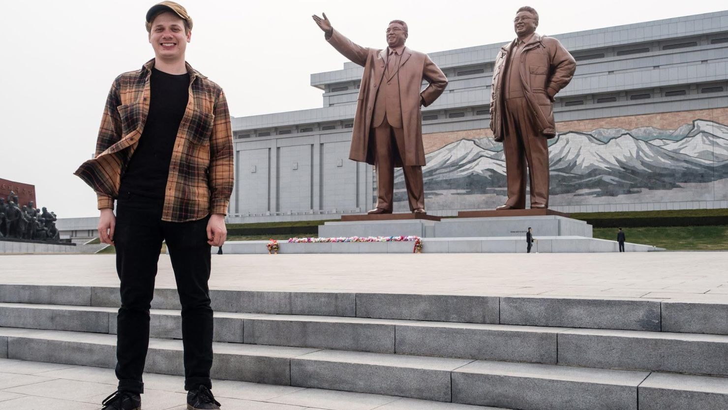 Justin Martell stands in front of Mansudae Hill Grand Monument on a trip to Pyongyang in 2015.