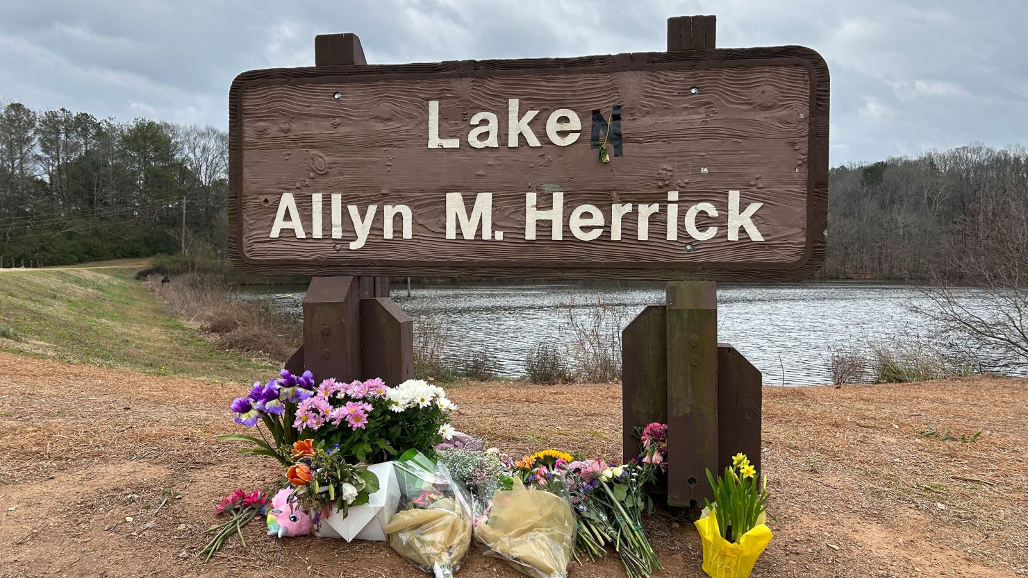 A makeshift memorial is set up for Laken Riley near where she often ran in Athens, Georgia. Riley was attacked and killed last month while running.