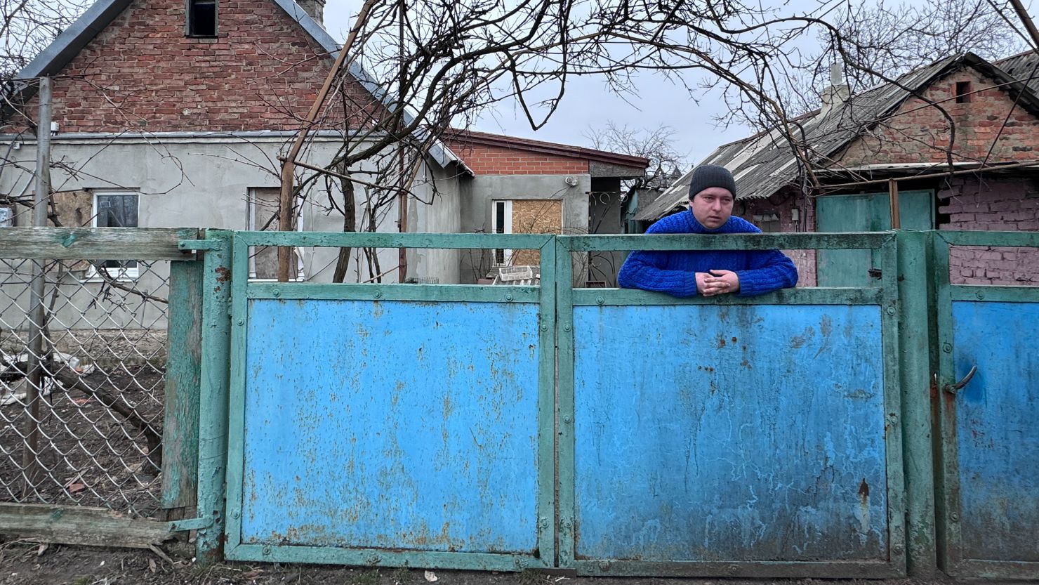 Euhene in Ocheretyne says he is ready to evacuated if the Russians come closer. The houses on either side of his have been hit by Russian shelling.