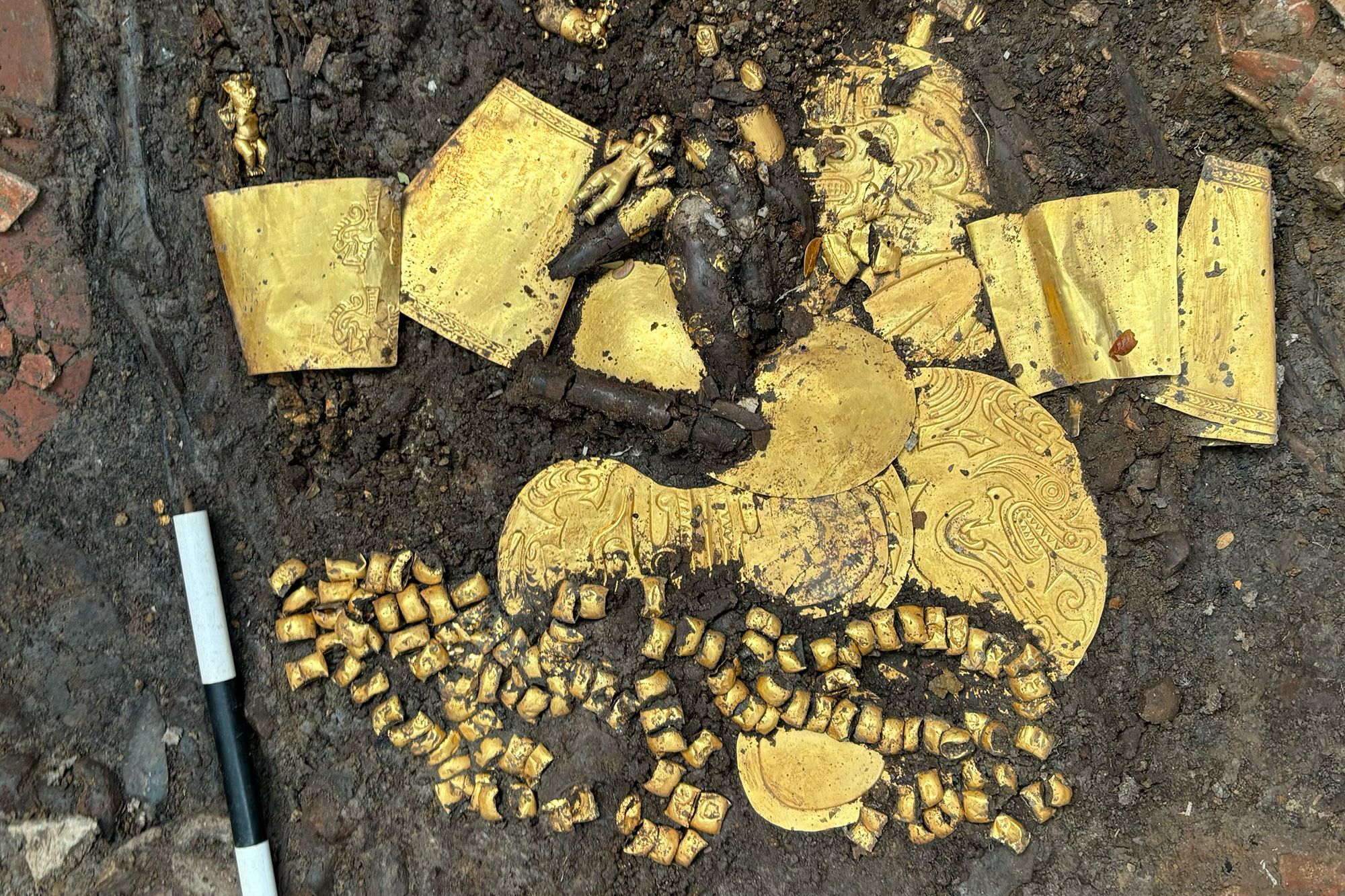 Gold and sacrificial victims found in tomb of ancient leader,  archaeologists say | CNN