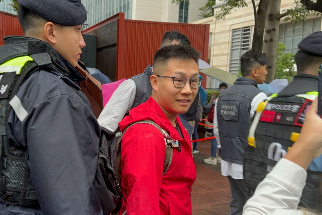 Police pull prominent activists from the queue to conduct search, including Raphael Wong Ho-ming.