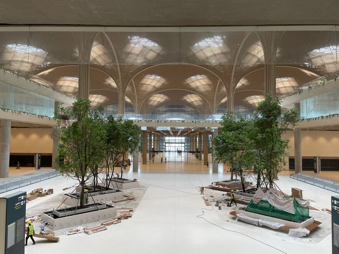 Local trees were planted in baggage claim as a way to acclimate visitors to Cambodia's climate.