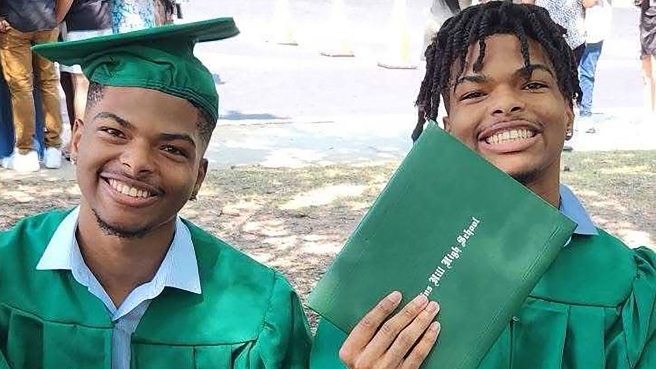Twins Qaadir and Naazir Lewis at their high school graduation in 2024.