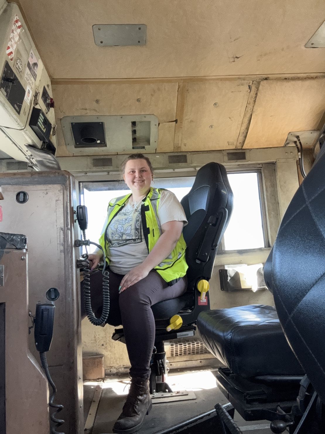 Jasmine Geib, a conductor for Union Pacific and former Job Corps student, sits in a locomotive in August 2021, in North Platte, Nebraska.