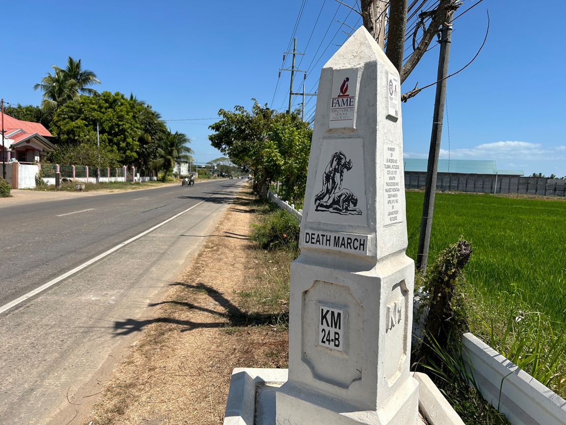 White markers along a highway on the Bataan Peninsula show the route from the 1942 Bataan Death March.