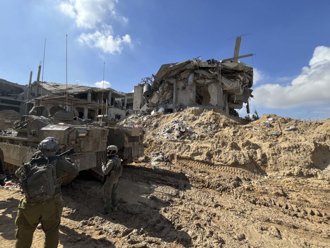 Israeli soldiers patrol the area around an entrance into the tunnel network underneath Khan Younis.