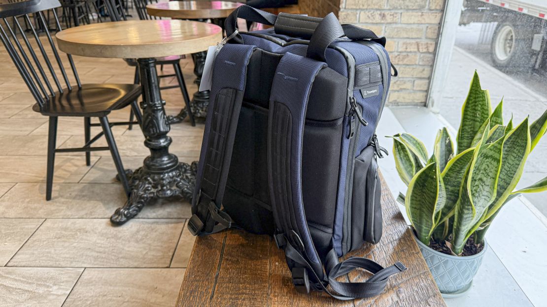 Back of the Travelpro Attitude Medium Backpack in a cafe