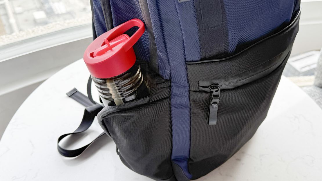 A water bottle in a Travelpro Attitude Medium Backpack