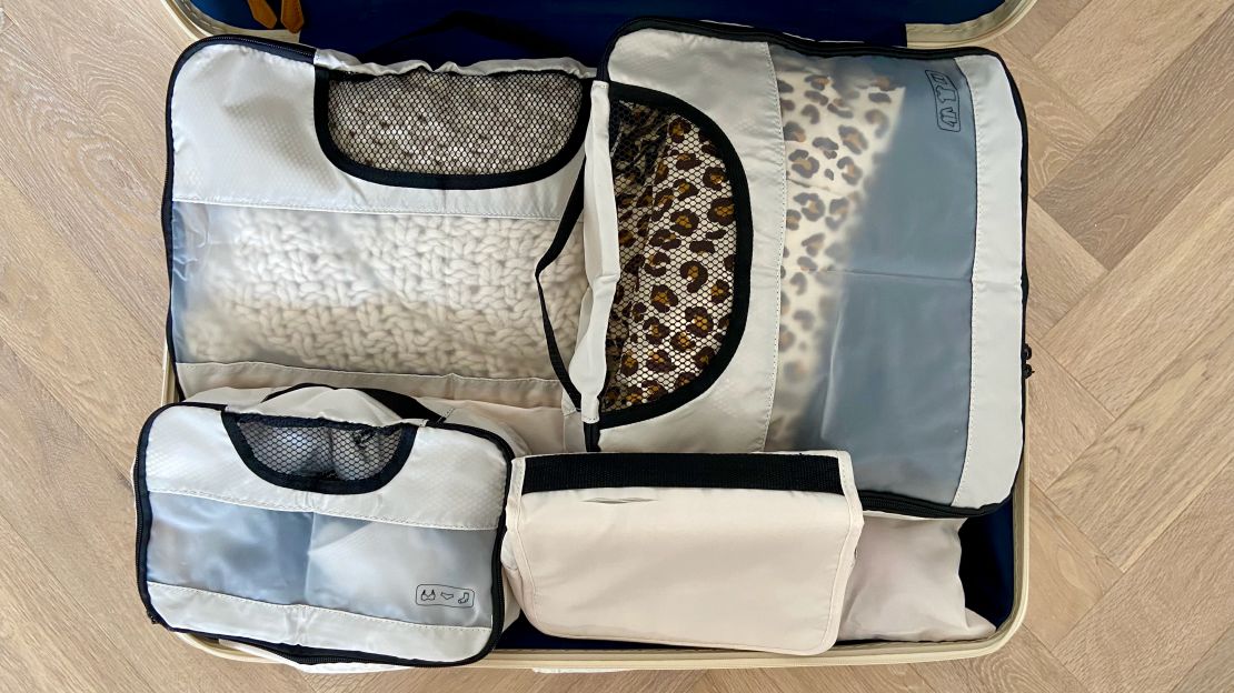 A photo of multiple Veken packing cubes in a Paravel carry-on bag