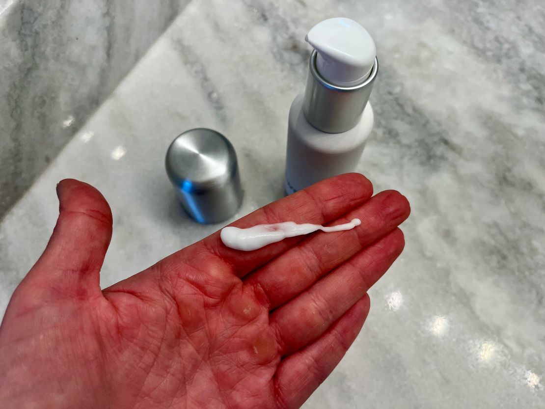 A photo showing lotion dispensed from a S'well Travel Bottle