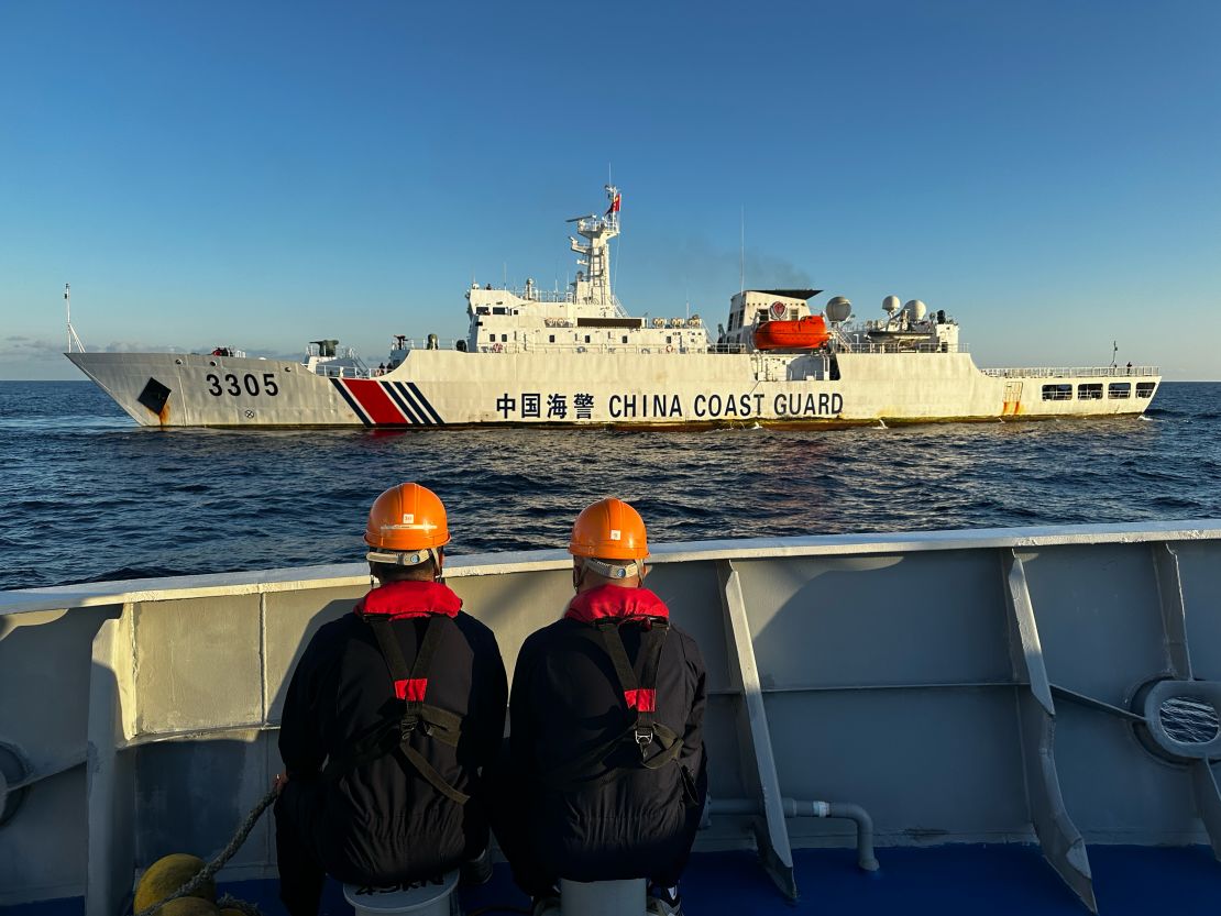 A China Coast Guard vessel sails close to a Philippines ship during a day of clashes in the South China Sea, March 5, 2024