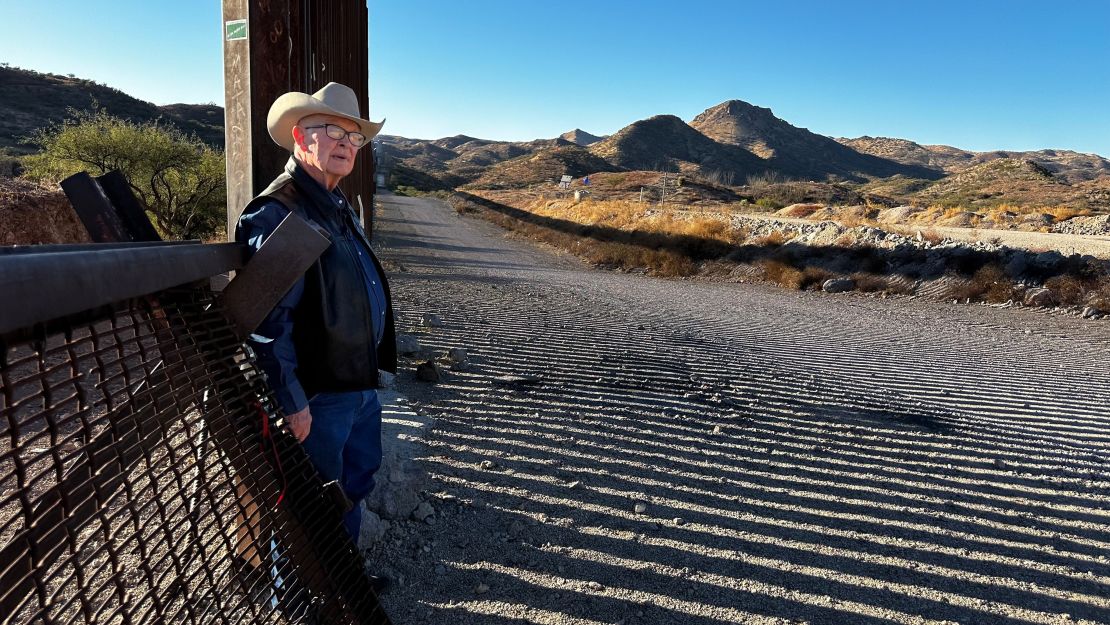 Rancher Jim Chilton stands at the US-Mexico border, where the wall ends, on his family’s ranch southeast of Arivaca, Arizona.