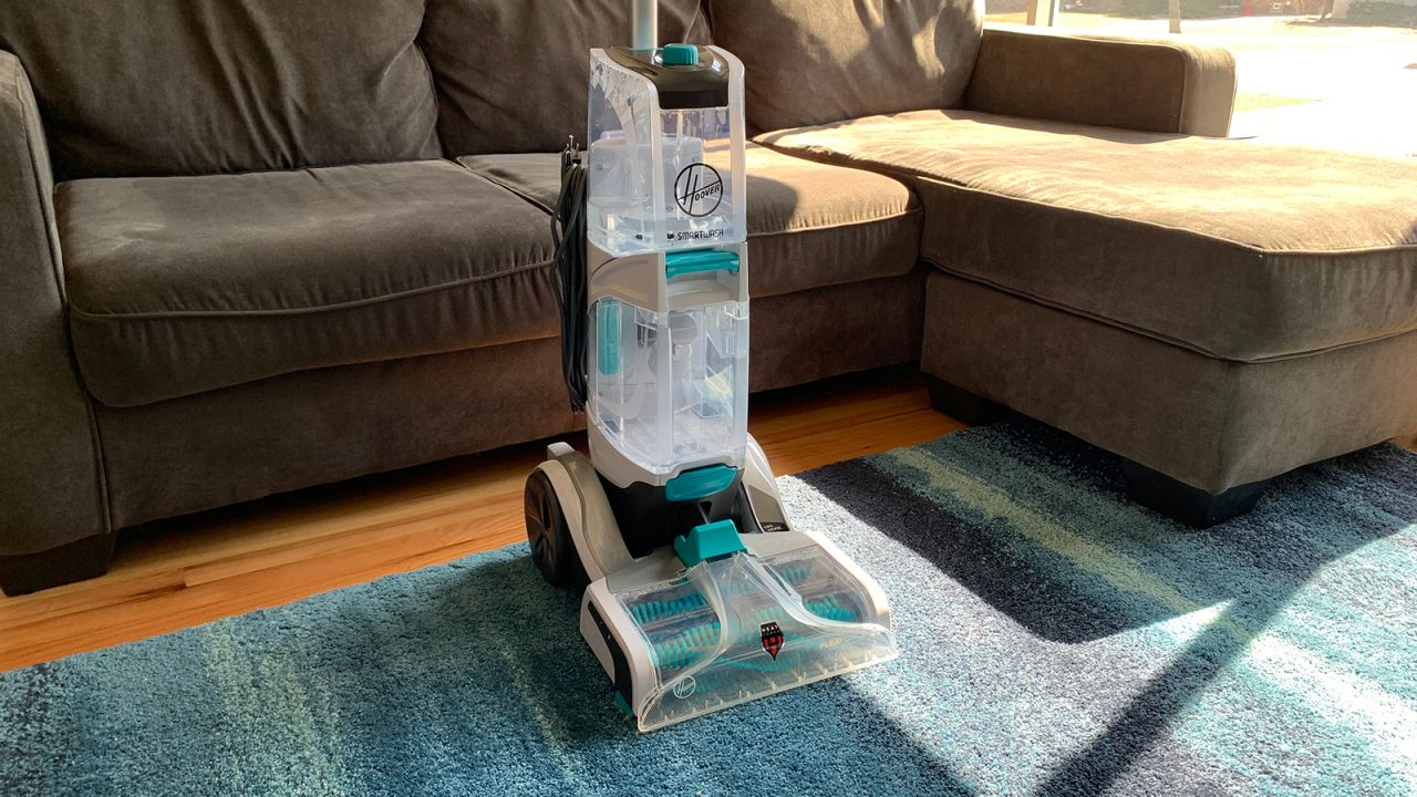 The Hoover SmartWash+ automatically sprays cleaning solution when you push the cleaner forward.