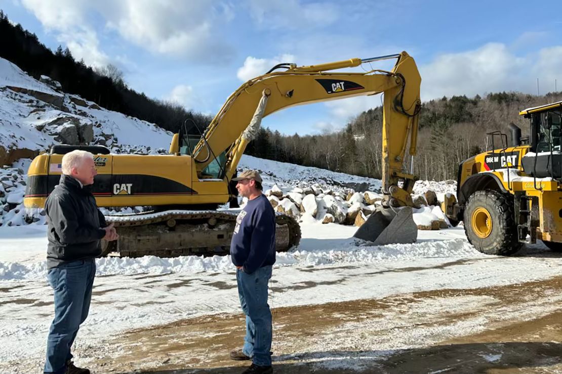 John King speaks with New Hampshire voter Deven McIver at a rock quarry in North Woodstock, New Hampshire, in January.