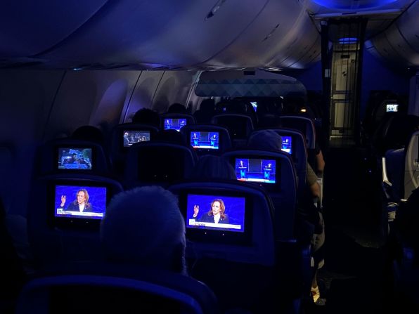 People watch the debate on a flight traveling from California to Georgia.