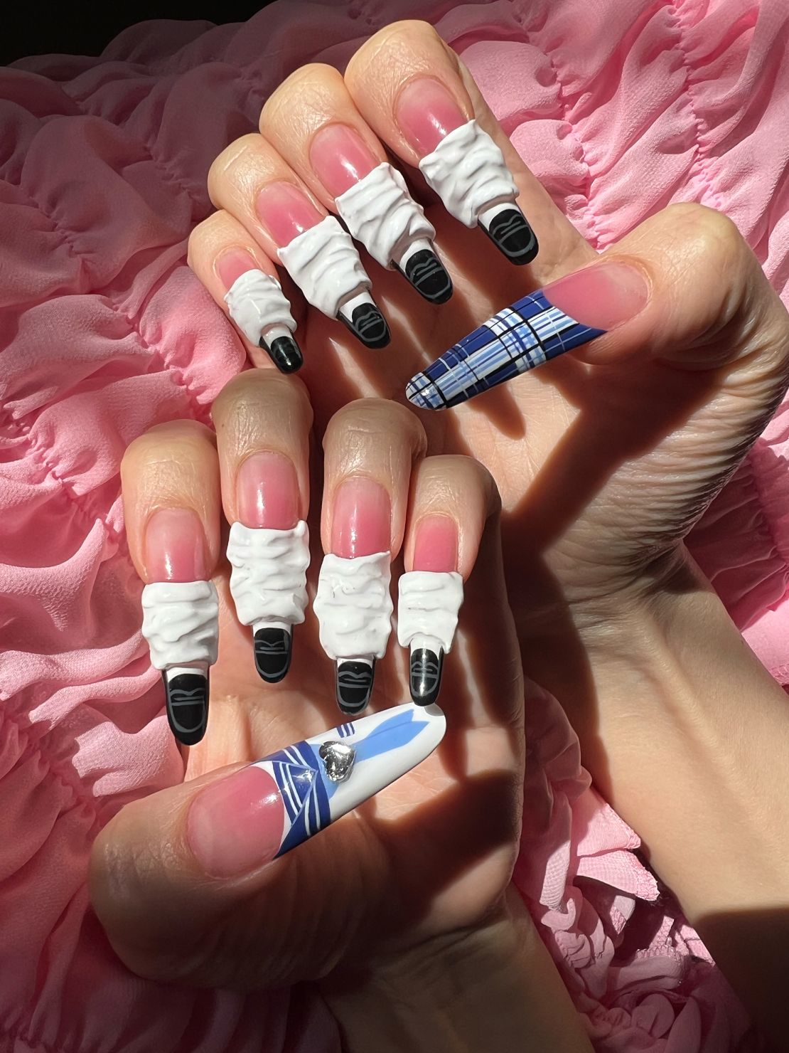 A manicure by nail artist Mei Kawajiri, inspired by the Japanese sailor suit school uniform.