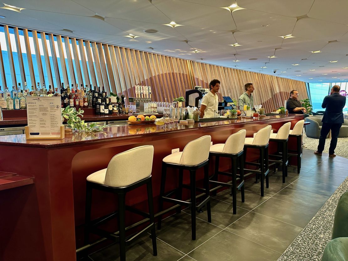 A photo of bar seating at the Capital One Lounge at Washington Dulles International Airport (IAD)