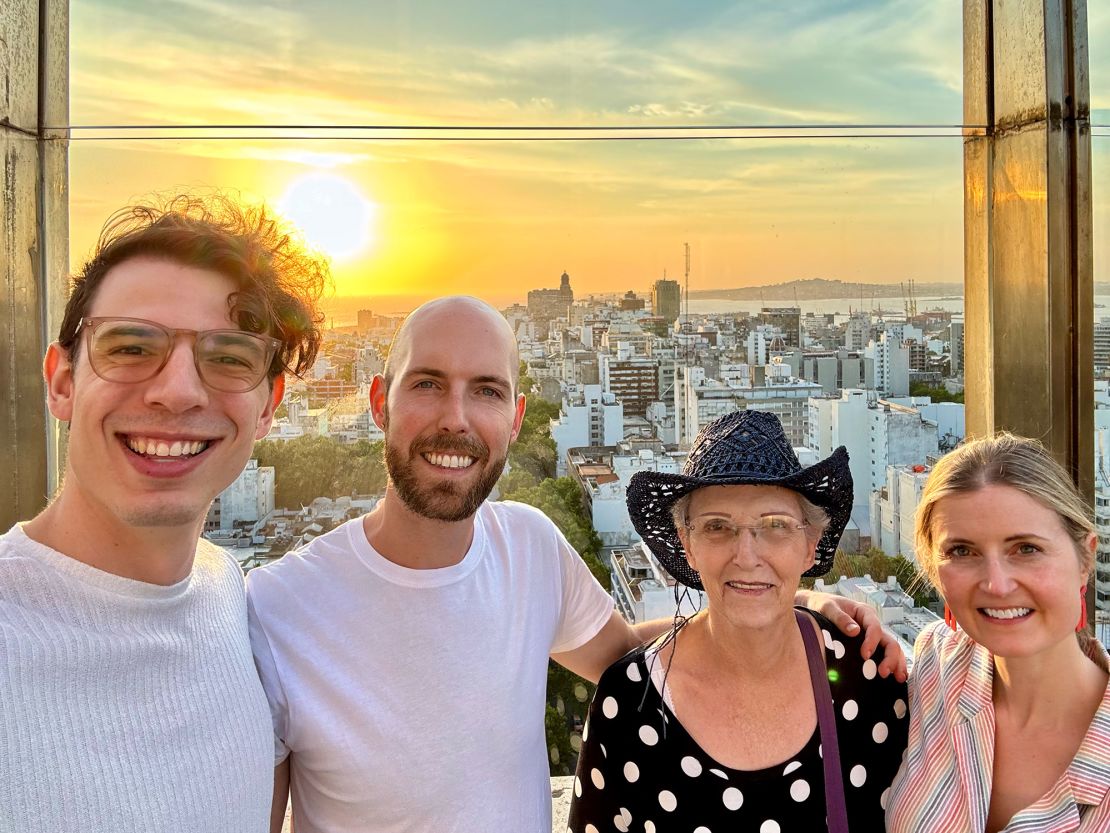 The couple with Austin's grandmother Bonnie and friend Jennifer, far right, at the top of City Hall of Montevideo last year.