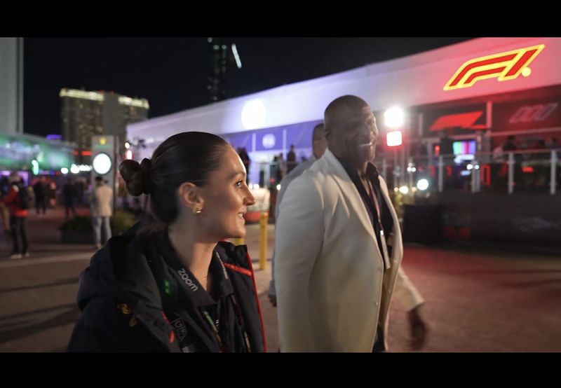 Porter - seen here guiding Terry Crews - says her job is rewarding but can sometimes be stressful on race days.