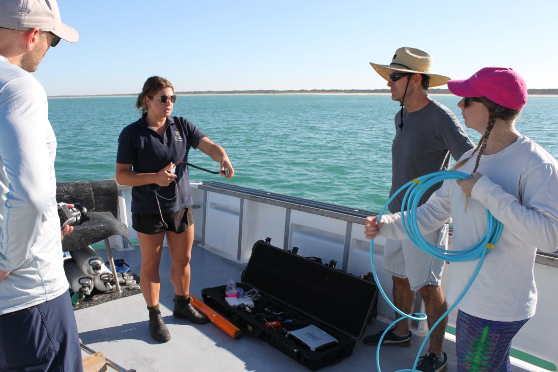 Maritime archaeological conservator Heather Berry (far right) of the Silentworld Foundation helps Flinders University doctoral student Justine Buchler (second from left) prep a marine magnetometer while explaining its deployment to Mark Polzer (second from right), a maritime heritage officer for the Department for Environment and Water South Australia, and Ruud Stelten (far left), an associate lecturer at Flinders.