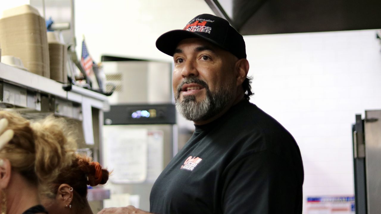 Antonio Munoz, owner of 911 Taco Bar, checks in on his staff during the lunch hour rush.