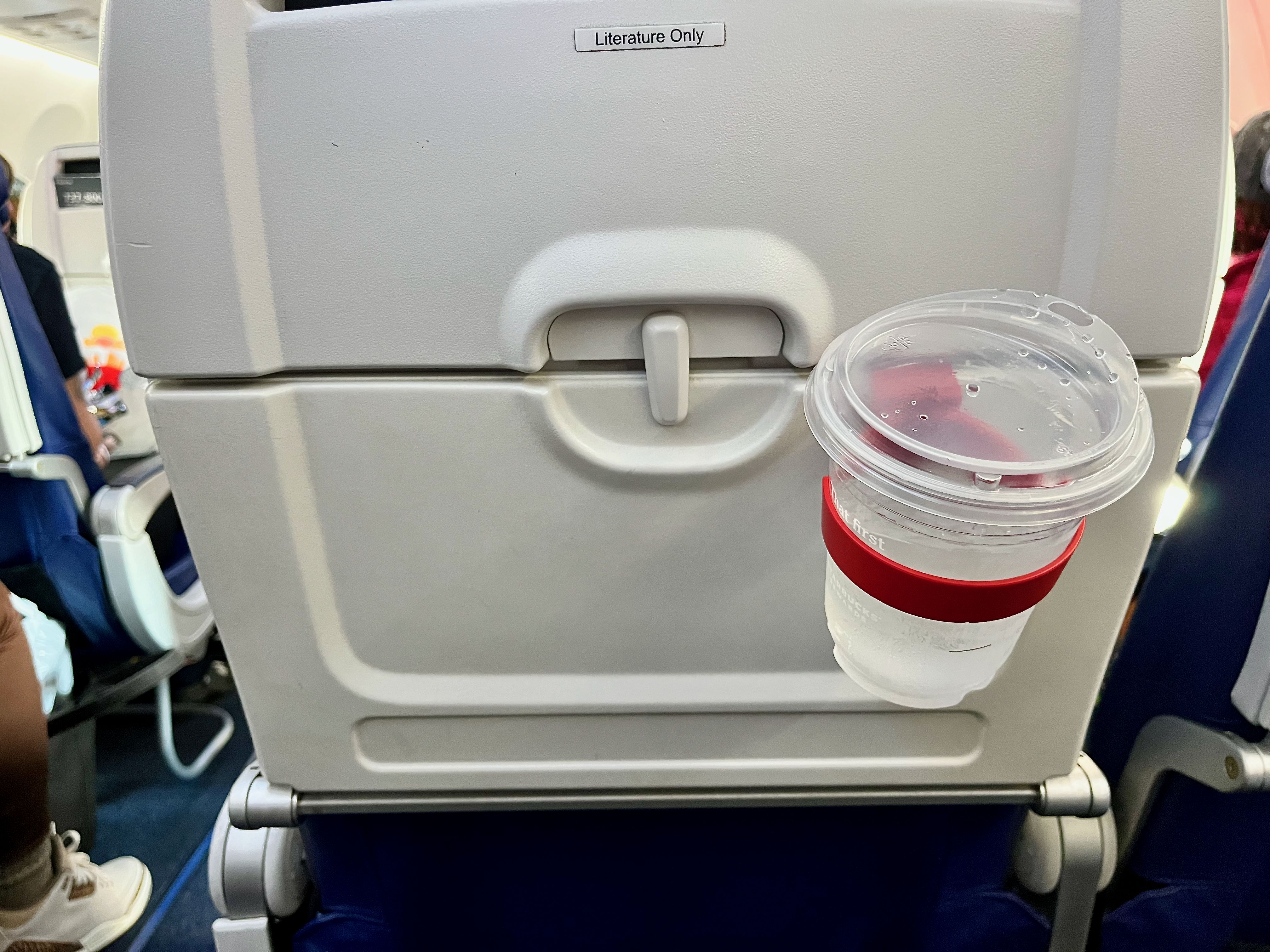 Clarendon resident launches portable airplane seat cup holder