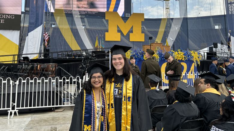 Anushka Jalisatgi, left, and Jade Gray attend the University of Michigan's 2024 spring commencement.