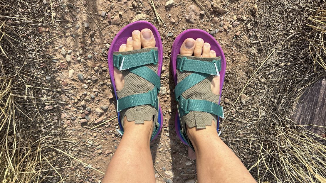 Feet with Teva Aventrail sandals.