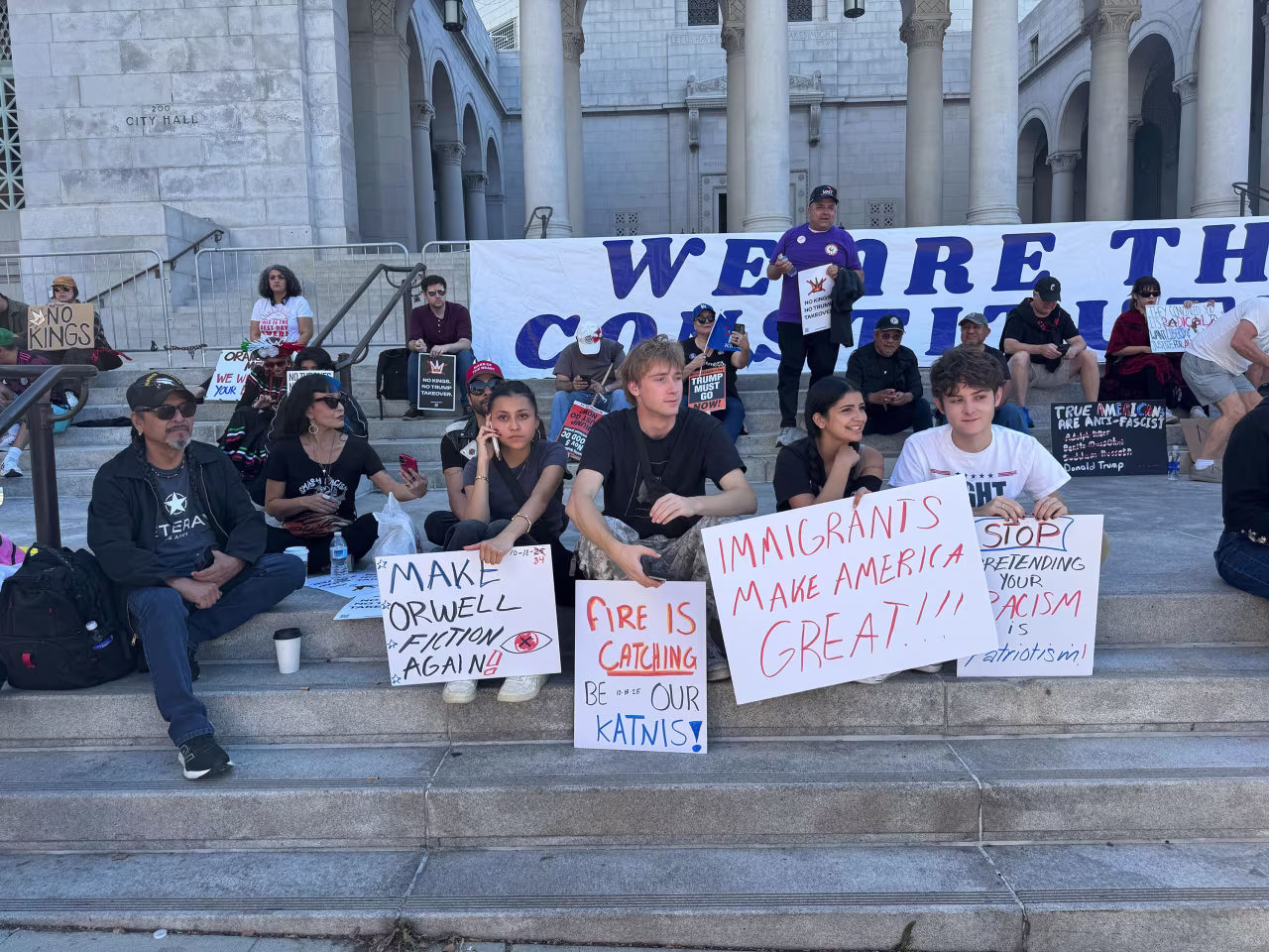 People gather around Los Angeles City Hall before of the protest Saturday.