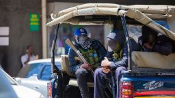 Masked men with guns and teargas canisters on the back of a police truck in Nairobi. A Kenyan judge ordered has previously police officers on duty to be clearly identifiable.