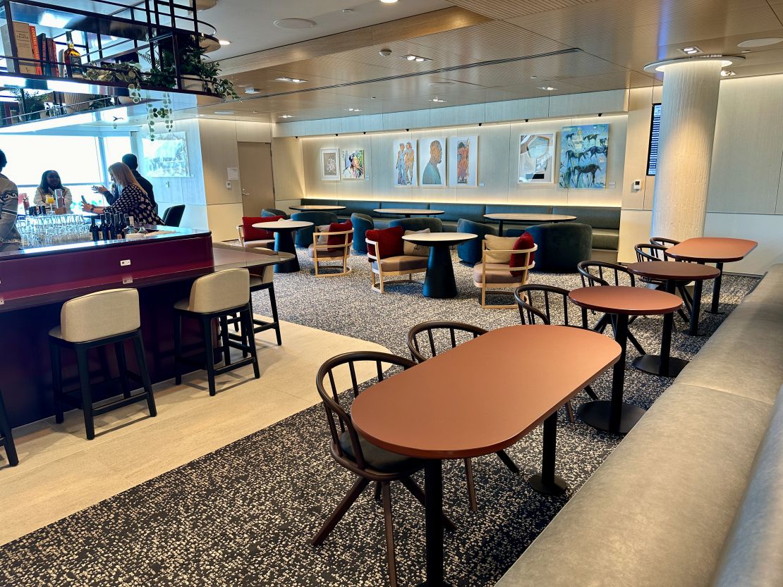 A photo of seating near the bar at the Capital One Lounge in Denver