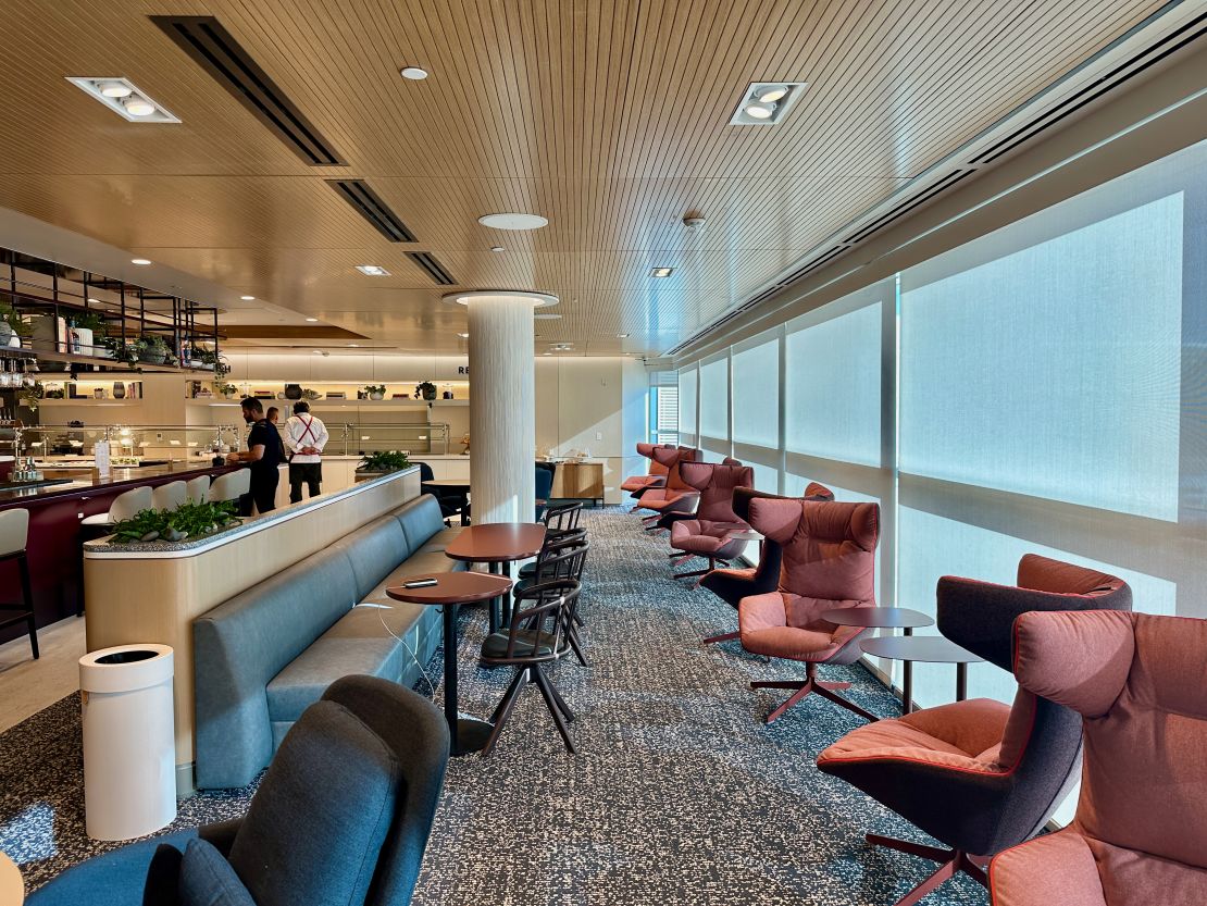 A photo of seating near the bar at the Capital One Lounge in Denver