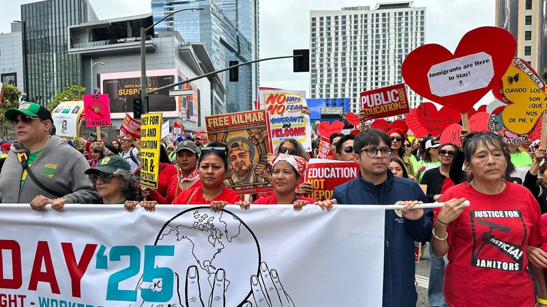 Demonstrators keep different signs and banner who are calling for the Kilmar Abrego Garcia to be brought back to the USA during a protest on Thursday in Los Angeles.