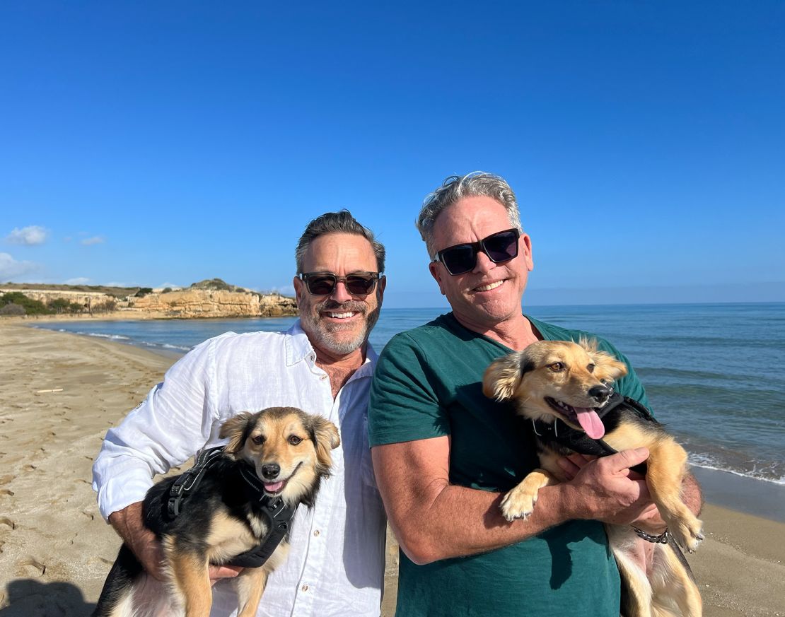 Randy, right, and Steve with their dogs Mimi and Lola.