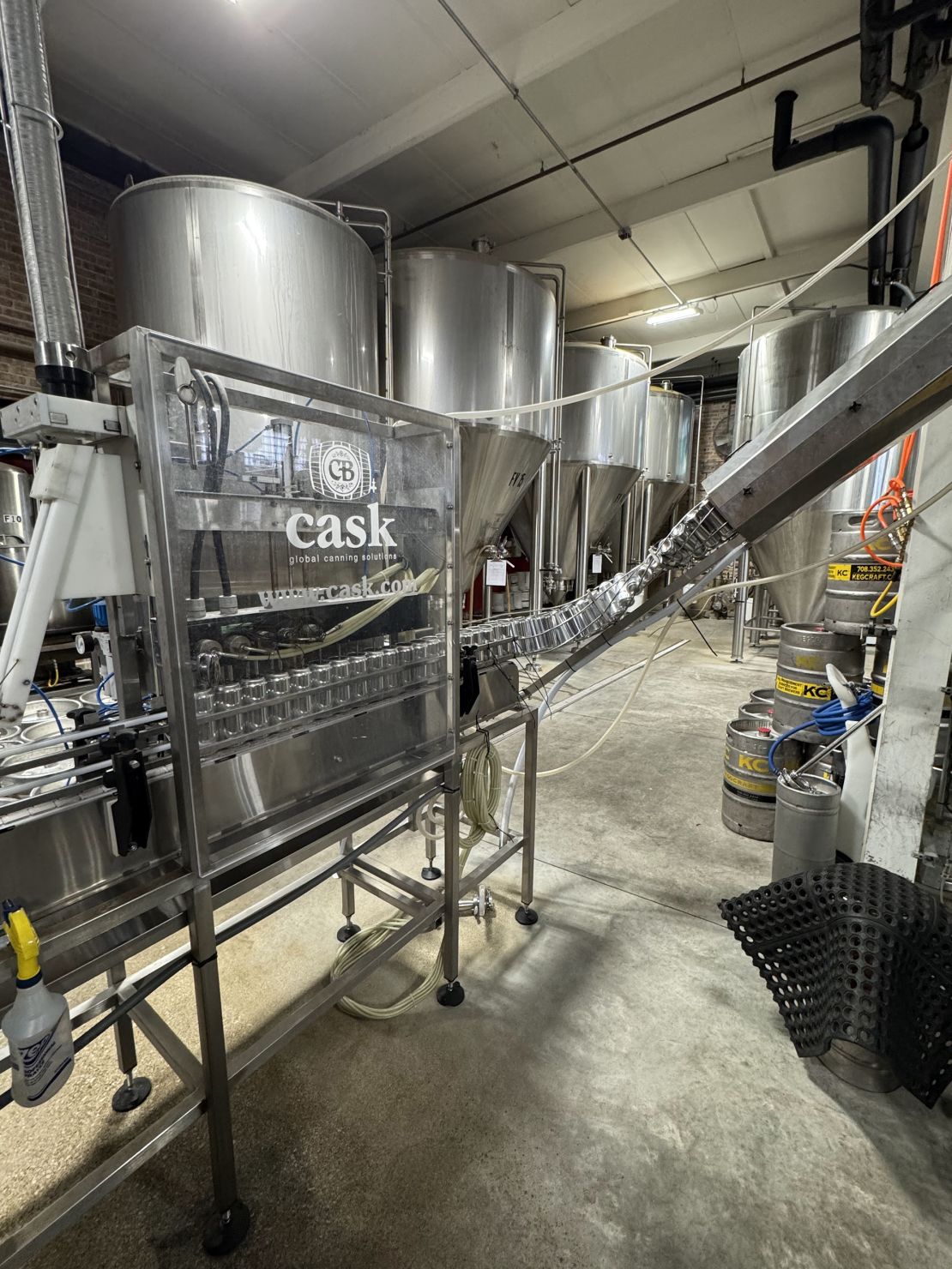 Cans in line to be filled with beer at Spiteful Brewing in Chicago.