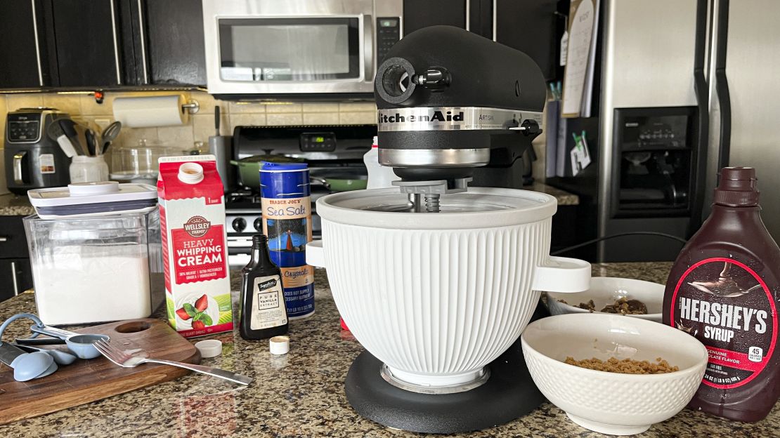 The KitchenAid ice cream maker and several ice cream ingredients on a kitchen counter.