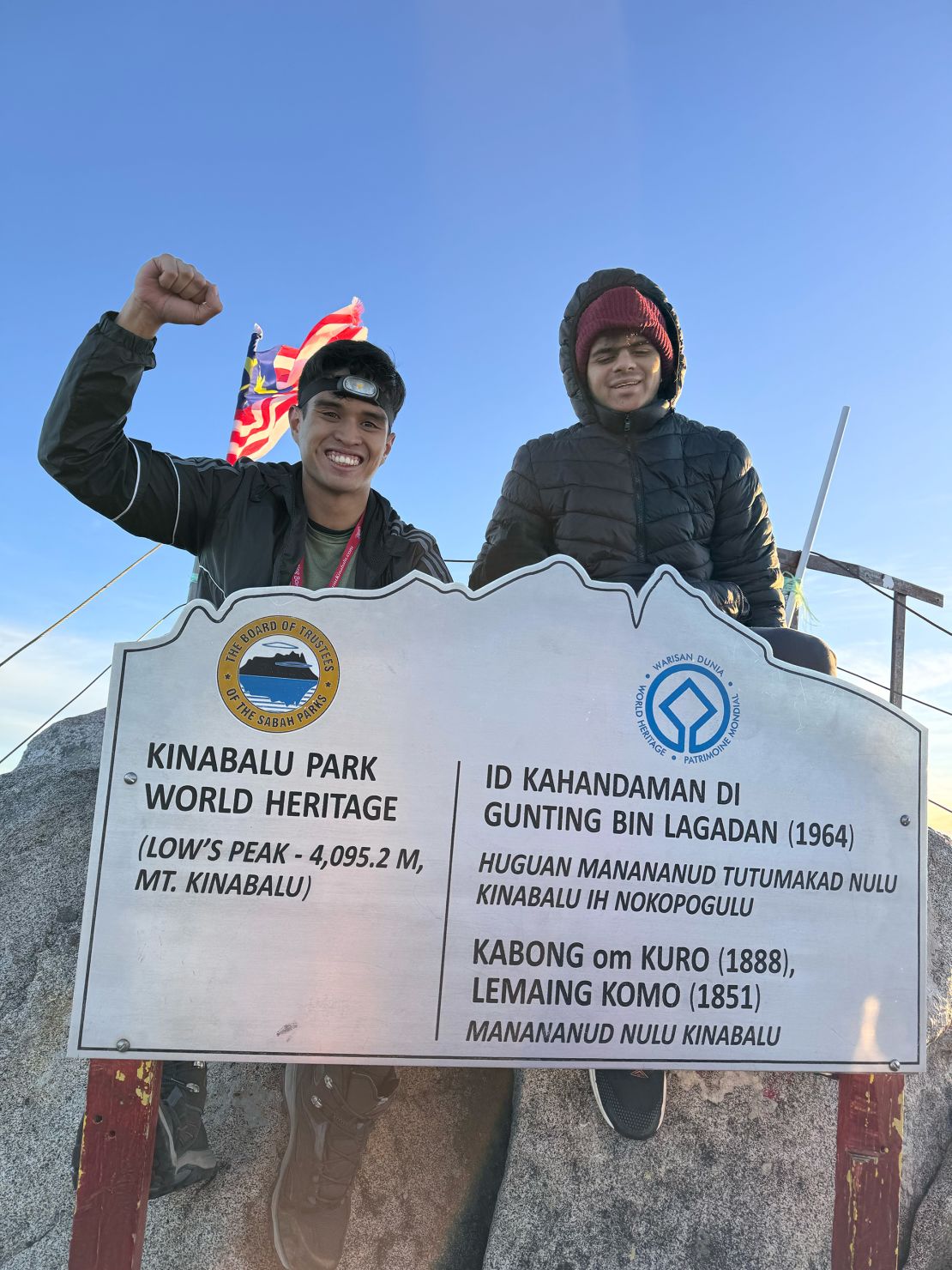 Uzayr and Patel at Low's Peak on the UNESCO-listed mountain.