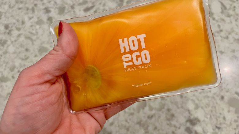 A photo of a hand holding a Hot To Go Heat Pack