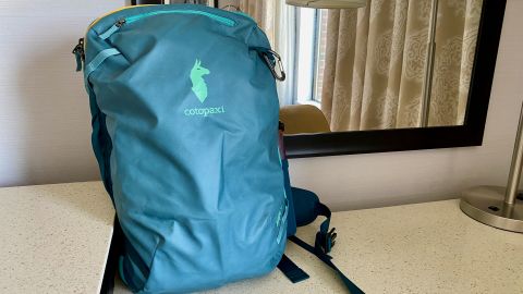 A photo of the front of a Cotopaxi Allpa 35L Travel Pack on a table